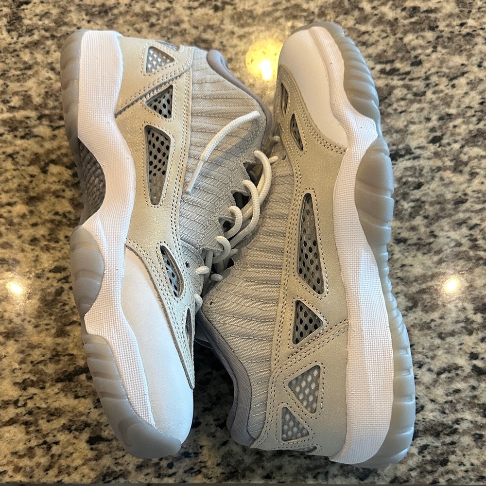 Jordan 11’s low top Gray and White  Athletic Sneakers